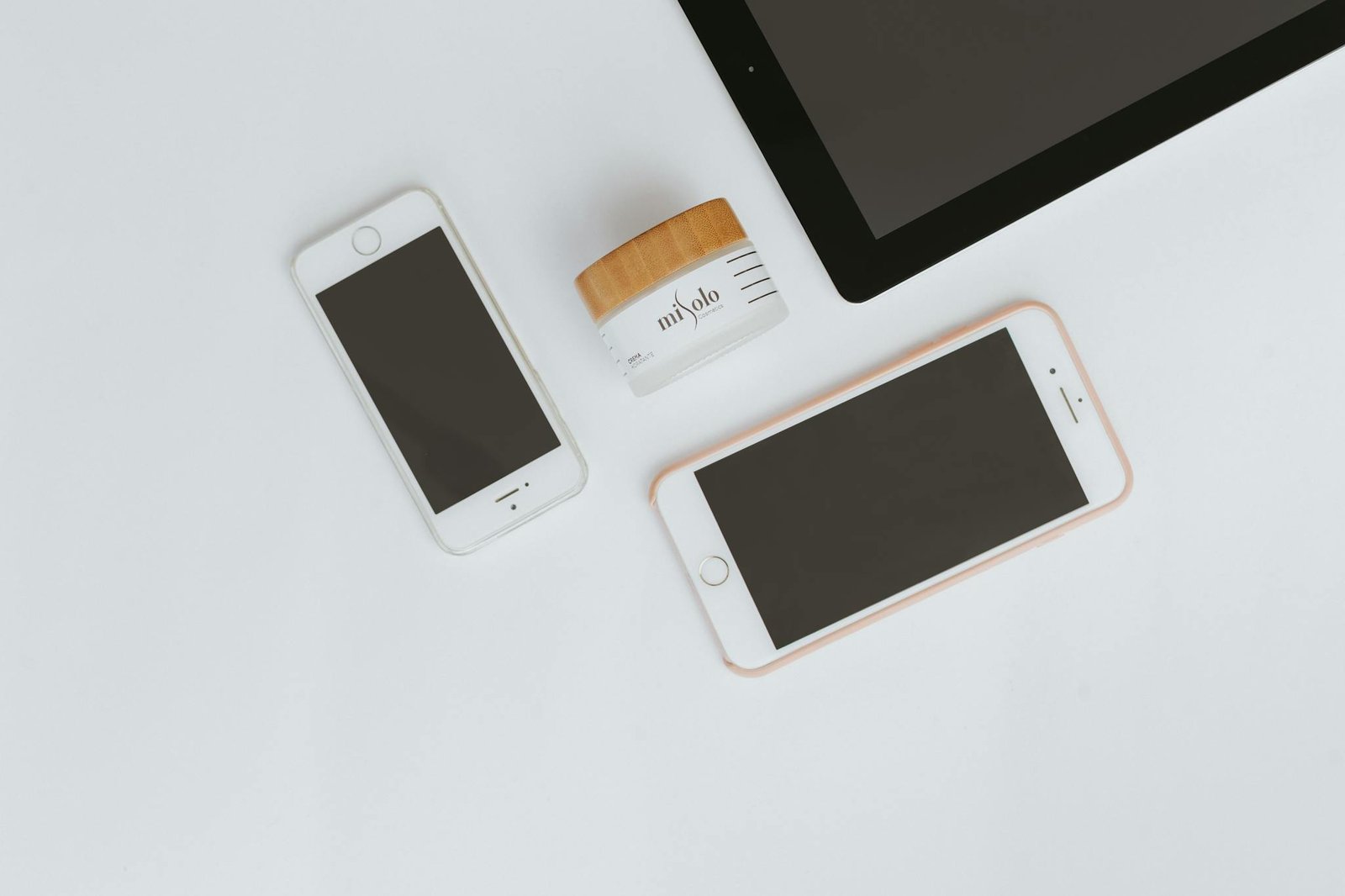 top view of smartphones tablet and skincare
